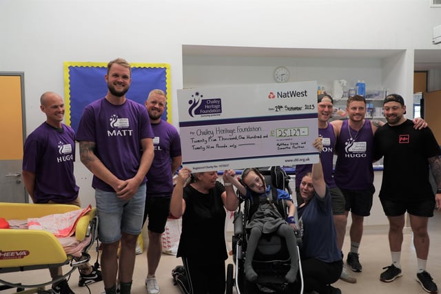 Matt and fellow runners with the cheque
