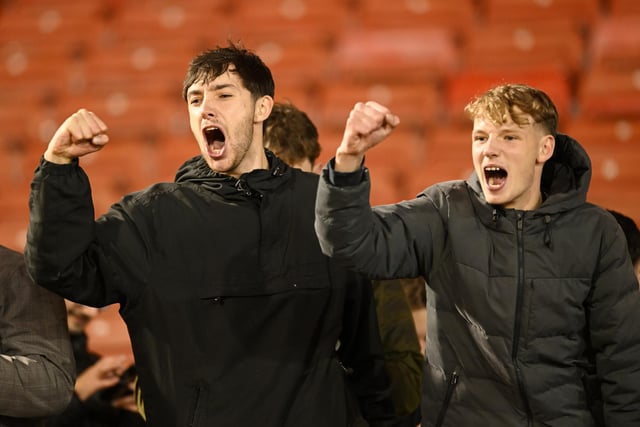Horsham fans celebrating after the Emirates FA Cup First Round match between Barnsley and Horsham at Oakwell Stadium.