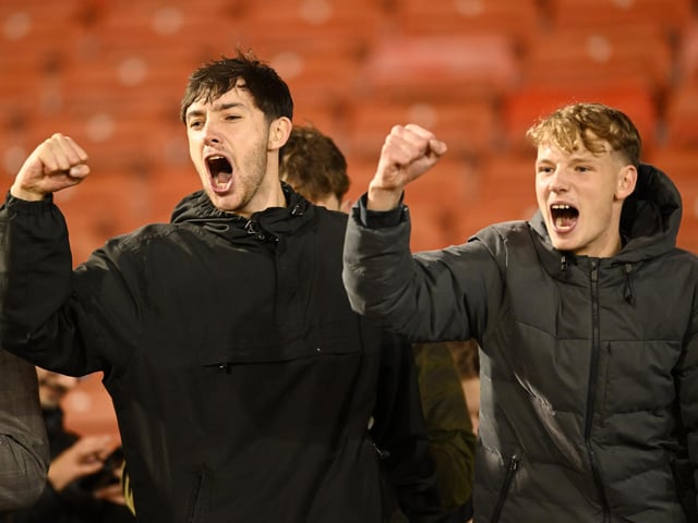 Horsham fans celebrating after the Emirates FA Cup First Round match between Barnsley and Horsham at Oakwell Stadium.