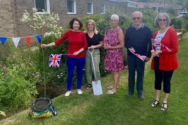 The Open House Parent and Toddler Group team with the Salix tree they planted for the Queen's Platinum Jubilee
