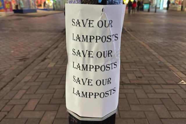 'Save our lamp posts' signs have been placed on each of the columns. Photo: Cllr David Small