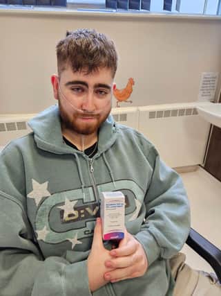 Luke receiving the first month's medication from the Royal Marsden Hospital in Sutton last week. The medication is costing nearly £8000 per month