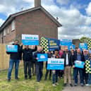 Richard Holden MP, Chairman of the Conservative Party (centre), campaigning in Crawley.