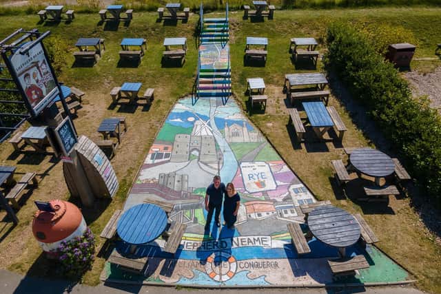 A seaside pub in East Sussex has made the 10 metre-long mural, made up of local landmarks including a castle and a windmill, the centrepiece of its pub garden.