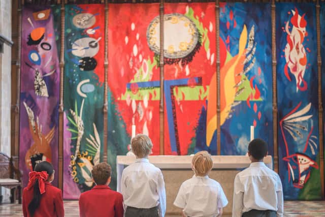 Children looking at Chichester Cathedral's Piper tapestry