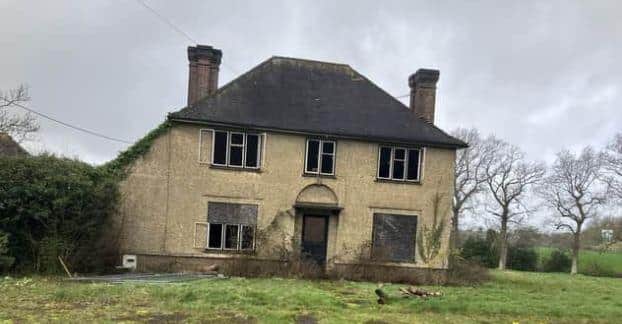 Planning permission is being sought to knock down a  'mystery house' on the edge of Horsham and replace it with 33 new houses and a 76-bed care home. Photo: Sarah Page