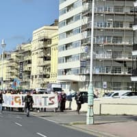 ‘We are all migrants’: photos show protestors marching near Hove lawns following plan to close asylum hotel
