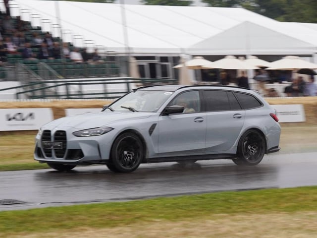 The Duke of Richmond takes the new BMW M3 Touring car for a spin on Thursday morning at the 2022 Goodwood Festival of Speed