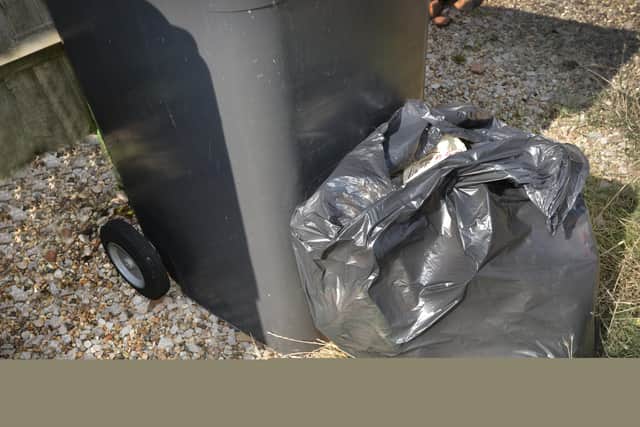 File: Black rubbish bin