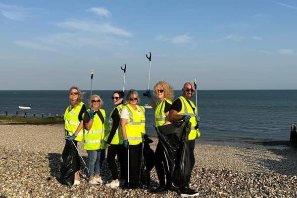 A team from Henry Adams New Homes and Persimmon Homes, Manor Gardens, help keep Selsey beach clean