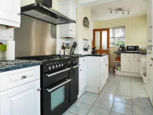 The well-appointed kitchen has built-in appliances