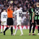 James Maddison of Tottenham Hotspur is shown a yellow card by ref Samuel Barrott during the Premier League match between Tottenham Hotspur and Brighton & Hove Albion last Saturday - and columnist Ian Hart says we don't need another colour of card introduced  (Photo by Julian Finney/Getty Images)