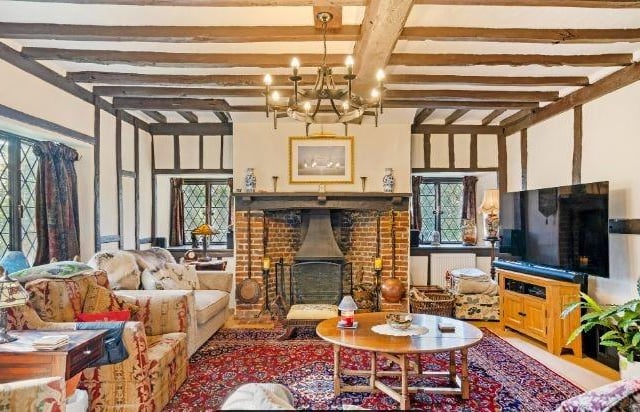 The generous sized dual aspect sitting room has a feature fireplace. There is also a family room which has double doors leading onto the gardens.