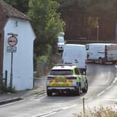 A photographer took pictures of the scene in East Dean last night (Monday, July 18), which show police in a cordoned off area with vans and a damaged bike.