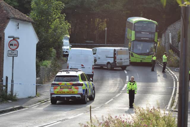 A photographer took pictures of the scene in East Dean last night (Monday, July 18), which show police in a cordoned off area with vans and a damaged bike.
