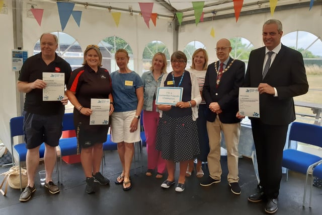 Arundel mayor Tony Hunt and Mandie Kane, community liaison dementia nurse with Sussex Partnership NHS Foundation Trust, with representatives from Dementia Friendly businesses in Arundel