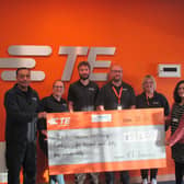Dilip Patel and his TE colleagues present the cheque to Alisha Hiremutt of Southdown.