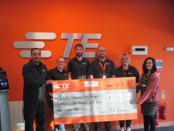 Dilip Patel and his TE colleagues present the cheque to Alisha Hiremutt of Southdown.