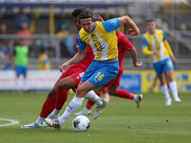 Action from Worthing's 3-0 win at Torquay United which put them top of National League South