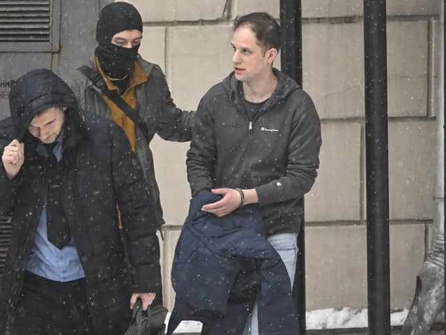 US journalist Evan Gershkovich (R), who was detained last March on spying charges during a reporting trip to the Urals, is escorted out of the Lefortovsky Court building in Moscow on January 26, 2024.