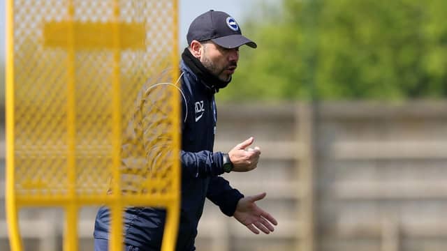 Brighton head coach Roberto De Zerbi keeps a close eye on his players during training