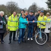 Arundel and South Downs MP Andrew Griffith and West Sussex county councillor Deborah Urquhart cut the ribbon, surrounded by members of Findon Parish Council and Findon Valley Residents Association
