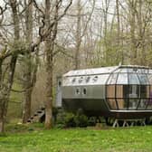 This unique, architecturally designed aluminium pod, nestled in a private woodland, provides a glamorous retreat. The Airship overlooks a dew pond on one end, and a meadow on the other. There are nearby woodland and countryside walks, bushcraft courses available on site and a BBQ area. The 'tiny home' hosts three guests, and has one bedroom, one bed and 1.5 bathrooms. Find out more and book your visit here: https://www.airbnb.co.uk/rooms/13126329