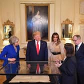 West Sussex County Archivist Wendy Walker delivered a presentation to President Donald Trump, Melania Trump, First Lady of the United States, Prime Minister Theresa May and her husband Philip May. Photo: MANDEL NGAN/AFP/Getty Images