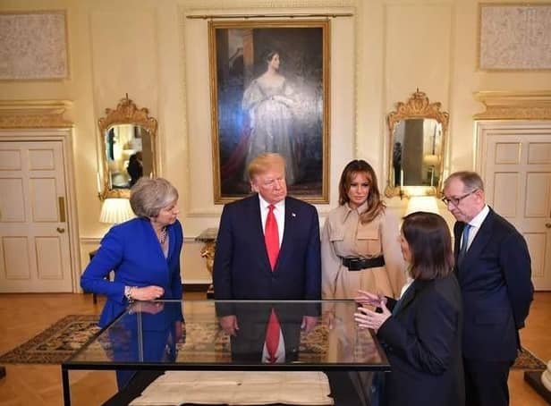 West Sussex County Archivist Wendy Walker delivered a presentation to President Donald Trump, Melania Trump, First Lady of the United States, Prime Minister Theresa May and her husband Philip May. Photo: MANDEL NGAN/AFP/Getty Images