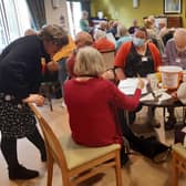 Mandie Kane, community liaison dementia nurse, left, chatting with people at Rustington Community Café & Friends
