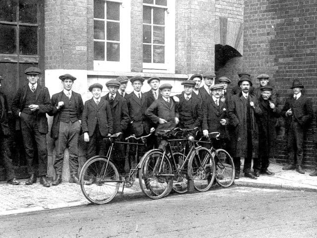 Men waiting to commence work at the West Sussex Gazette printworks