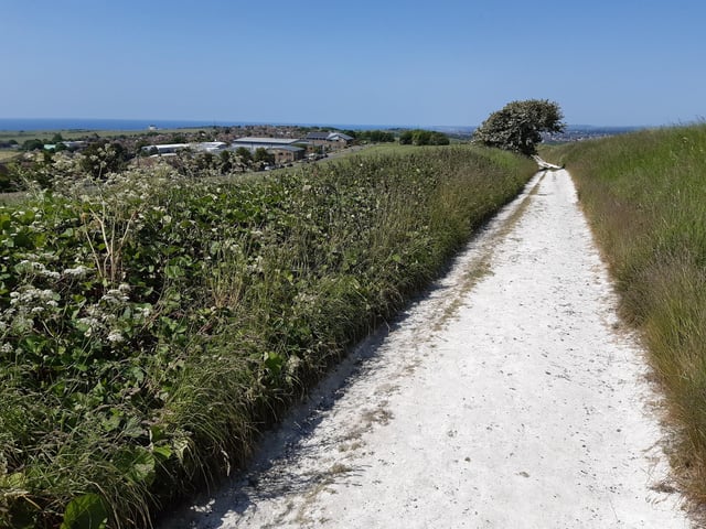 As you walk, you will see Castle House come into view on your left and that is where the bus stop is, if you want to take a note.