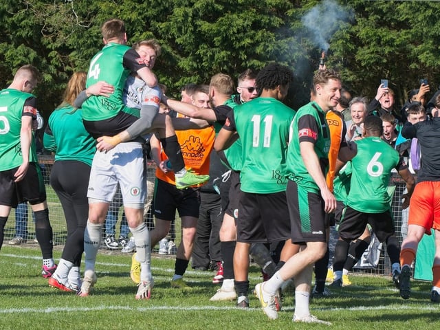Burgess Hill Town players, fans and staff celebrate surviving in the Isthmian south east division at the end of their 0-0 draw with Beckenham