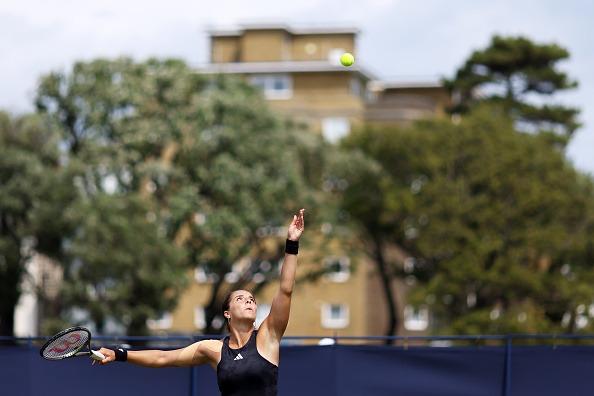 Jodie Burrage of Great Britain serves against Lauren Davis of United States in the Women's Singles First Round match