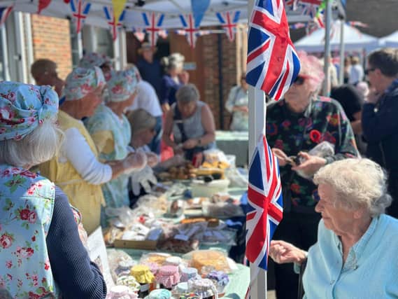 The Felpham WI sell hot drinks and homemade cakes outside the village memorial hall.