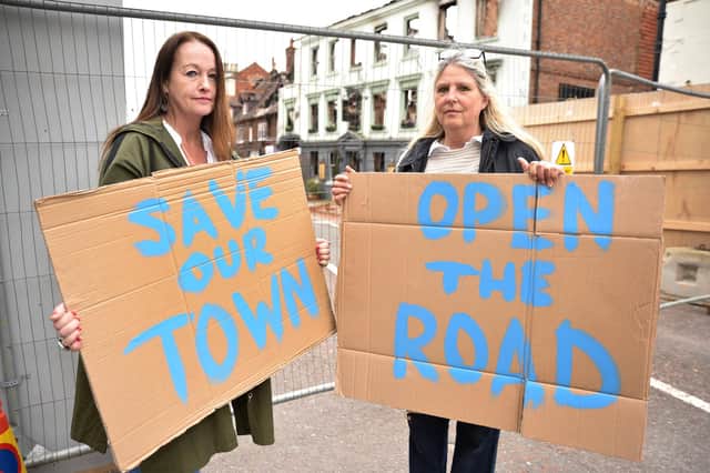 Sarah Moss and Caroline Bloomfield were amongst the protesters at Midhurst, and unhappy about the amount of time taken since the devastating fire at the Angel Inn before anything was being done to shore up the building and open the street. Pic S Robards SR2304271