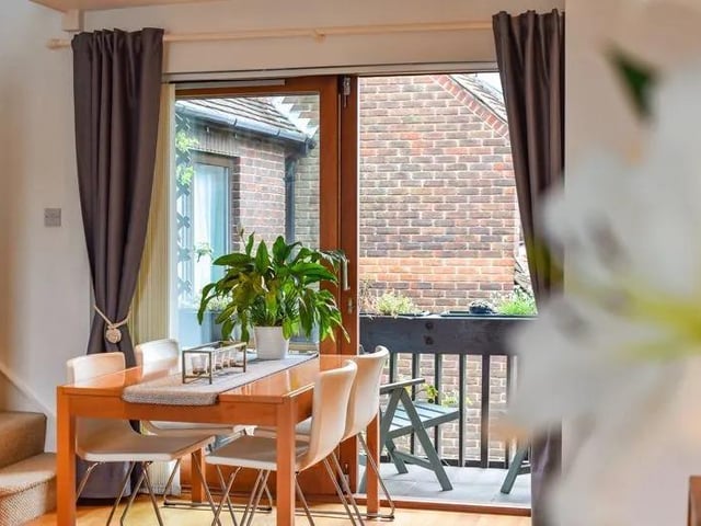 The open plan living room and dining room is perfect for entertaining guests.