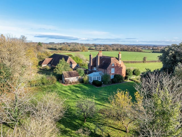 The 232-acre ring-fenced grassland farm has a seven-bedroom farmhouse