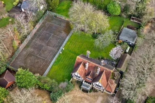Aerial view of the property and grounds showing the tennis court
