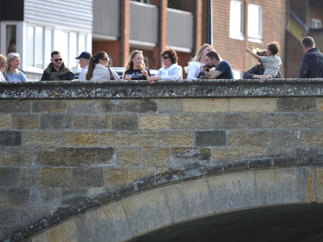 Crowds gather ahead of the Arundel RNLI Duck Race on Bank Holiday Monday.