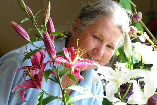 Margaret Bentall with her lilies. Picture: Kate Shemilt ks16000848-4
