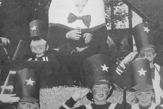 All the King's men, alias scouts from the 2nd Southwater pack, keep an eye on Humpty Dumpty at the Southwater Carnival in 1994