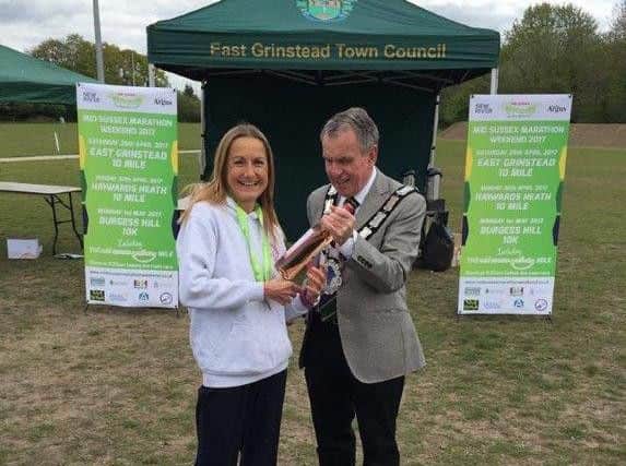 Ann Sinnett receiving her prize at the at the East Grinstead 10 miles race for being 1st in her age category