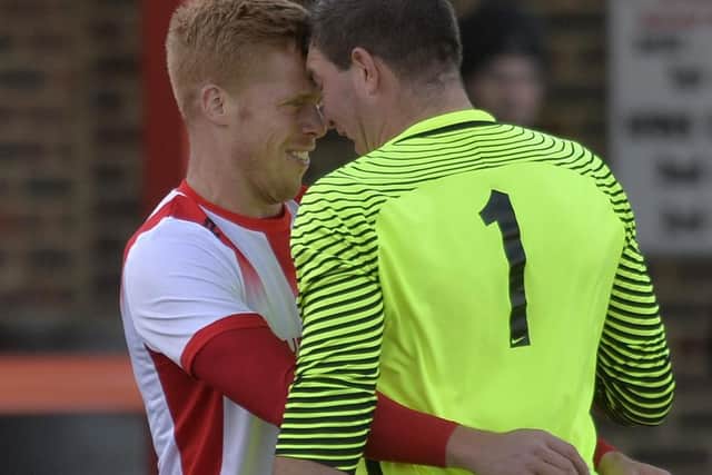 A coming together between Langney Wanderers' Trevor McCreadie and Horsham YMCA 'keeper Aaron Jeal saw both players booked for their part in the altercation. Picture by Jon Rigby.