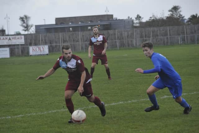 Action from Shoreham's 2-2 away draw with Little Common in the league on Saturday. Picture by Simon Newstead.