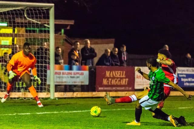 Debutant Keano Deacon slid home the third for Burgess Hill Town against Merstham on Saturday. Picture by Chris Neal.
