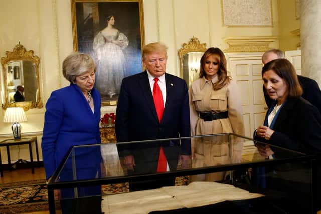 West Sussex County Archivist Wendy Walker delivered a presentation to President Donald Trump, Melania Trump, First Lady of the United States, Prime Minister Theresa May and her husband Philip May. Photo: HENRY NICHOLLS/AFP/Getty Images