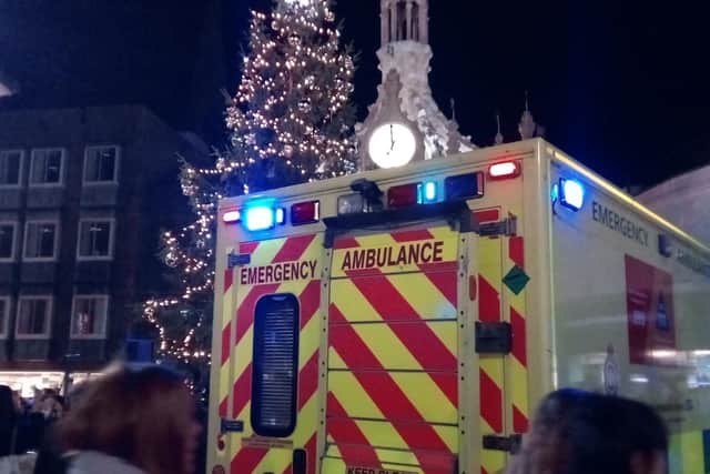 The ambulance parked by the Cross just after the lights switch on.