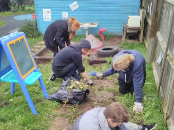Students hard at work in the garden