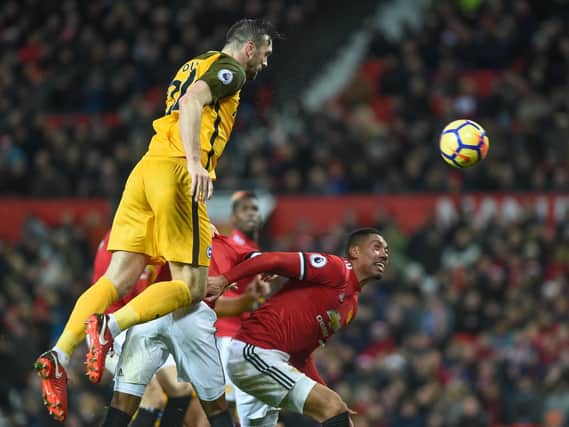 Shane Duffy wins a header at Old Trafford. Picture by Phil Westlake (PW Sporting Photography)